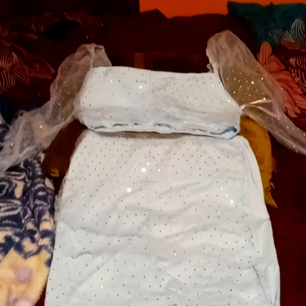 2pc light blue outfit sheared in front top and skiry